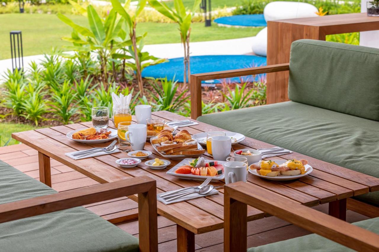 Outrigger Khao Lak Beach Resort - Sha Extra Plus Bagian luar foto A breakfast table