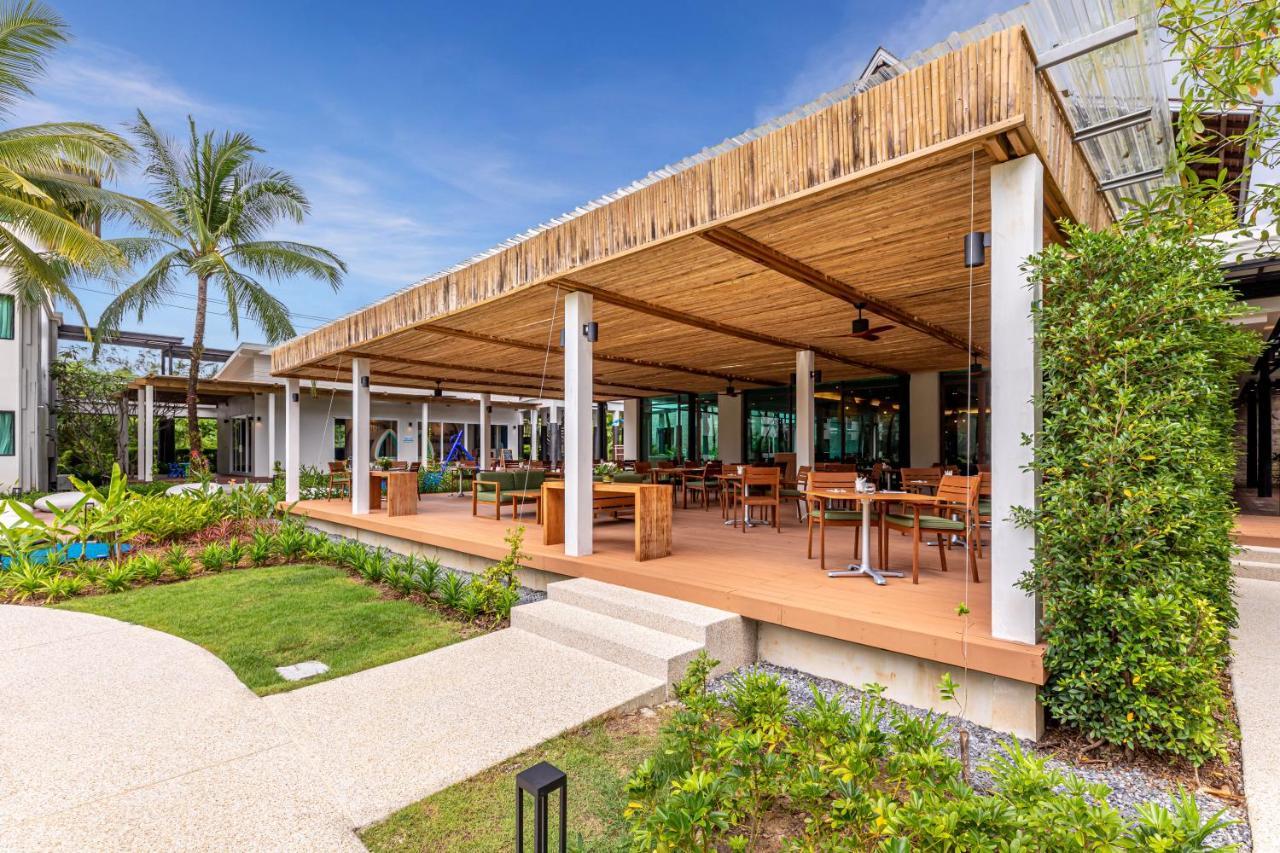 Outrigger Khao Lak Beach Resort - Sha Extra Plus Bagian luar foto The restaurant at the resort