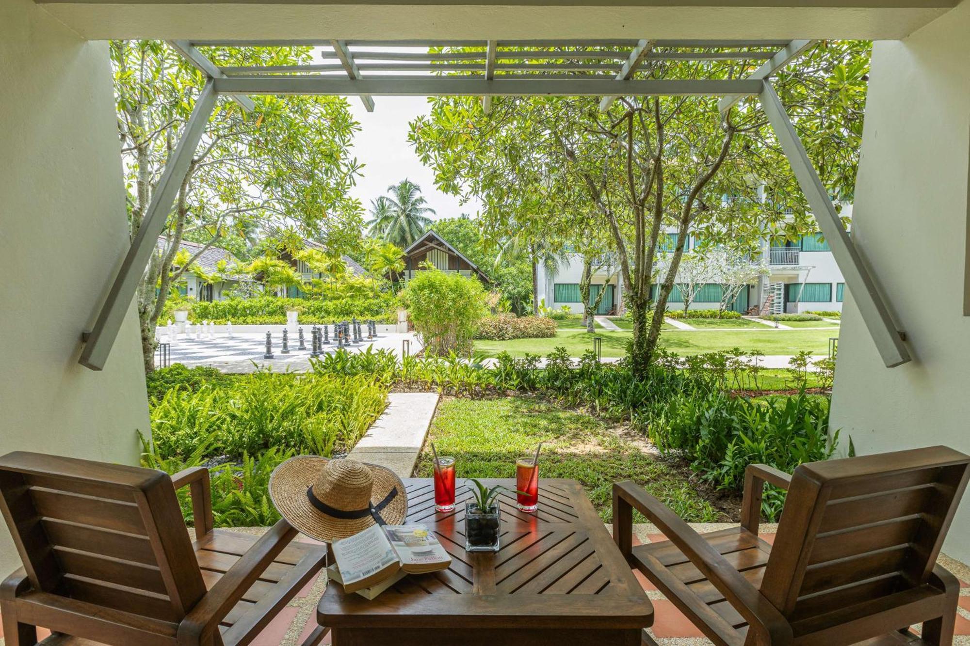 Outrigger Khao Lak Beach Resort - Sha Extra Plus Bagian luar foto The resort's garden